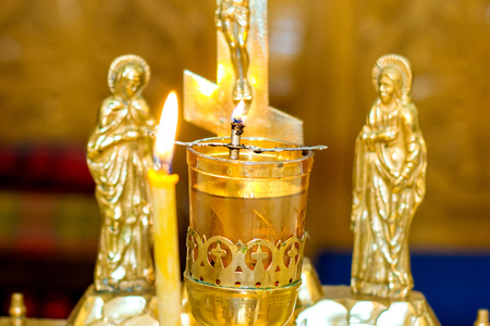 Close up golden and red censer hanging in churchのeditorial素材