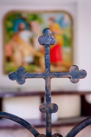 Iron cross on the background of the iconの写真素材