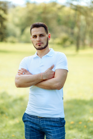 Portrait Of A Handsome Man Smiling At The Camera At The Parkの写真素材