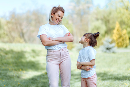 Outdoor portrait of mother and toddler age daughterの写真素材