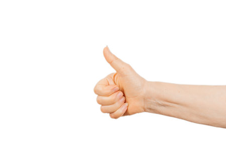 Female hand showing thumb up isolated on white backgroundの写真素材