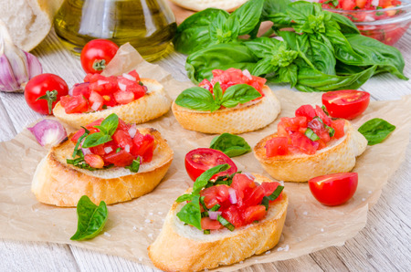 Bruschetta with tomato, onion and fresh basilの写真素材
