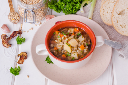 Vegan soup with pearl barley, vegetables and mushroomsの写真素材