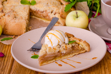 Open pie or galette with apples with cinnamon and crumbsの写真素材