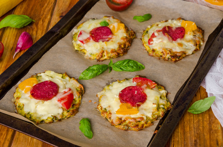 zucchini pizza with pepperoni, tomatoes, cheese and basilの写真素材