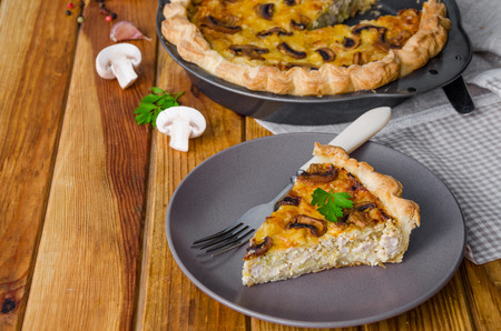 Quiche on puff pastry with leek, meat and mushrooms.の写真素材