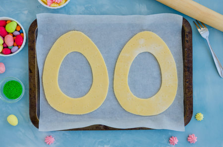 Recipe step by step. Step 3. Cakes for making Easter cake egg shaped on a baking tray. Horizontal...