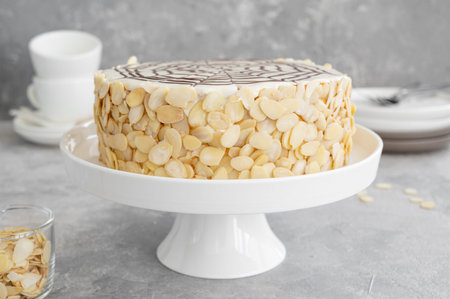 Traditional Esterhazy cake with almonds and pralines on a gray concrete background. Selective focus....