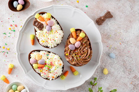 Easter dessert. Chocolate eggs with cheesecake filling decorated with chocolate candies and sugar...