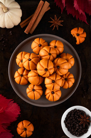 Halloween spicy mini cheesecakes with pumpkin puree in the form of small pumpkins. Halloween or Thanksgiving dessertの写真素材