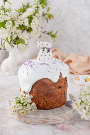 Easter sweet bread or Easter cake - Paska with sugar glaze, colored sprinkles and sugar bunny on top...