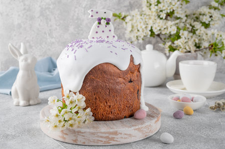 Easter sweet bread or Easter cake - Paska with sugar glaze, colored sprinkles and sugar bunny on top...
