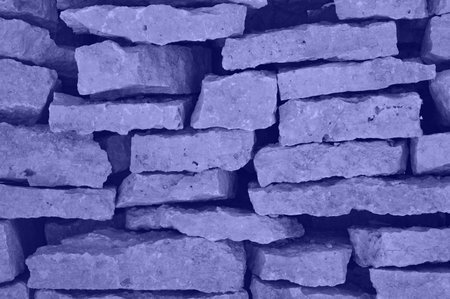 Very pery the color of the year 2022 The texture of a pile of limestone stones in sunlight