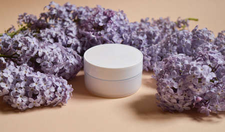 Empty white packaging tube for beauty spa, medical skin care and cosmetic lotion cream packaging, face wash foam, product design layout on beige backgroundの写真素材