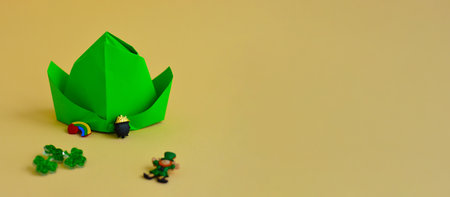 Banner with happy St. Patrick's day background. origami paper leprechaun hat. Simple diy with kids children's concept. Decoration of an Irish holiday.の写真素材