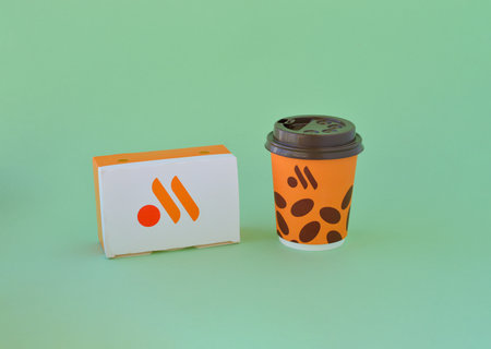 Pskov, Russia, April 06. 2023 packaging with logo of the Russian fast food reustaran on green backround- Tasty and thats it.のeditorial素材