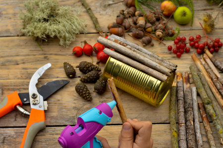 autumn craft with kids. How to make autumn floral decorations. Tutorial, 2-step by step. made of natural materials and old tin can, zero wasteの写真素材