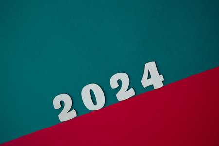 Happy New year 2024 number wood object on red and green background and copy space - new year celebrate and business resource concept - marketing resource design mock up.の写真素材