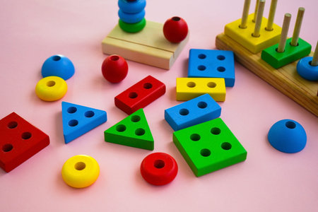 eco wooden toys. The child collects a sorter. Educational logic toys for kids. Games for Child Developmentの写真素材