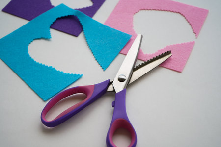 The scissors are lying on the pieces of felt. Needlework and sewing.の写真素材