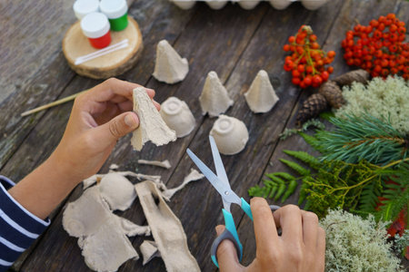 Step-by-step instructions on how to make autumn mushrooms from a cardboard egg carton.