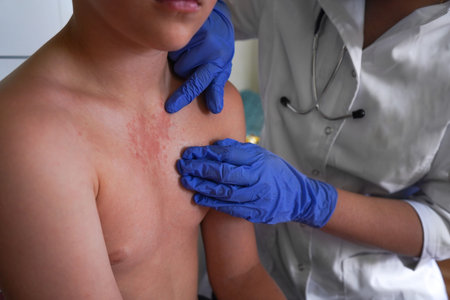 The doctor is assessing the boy for allergic skin reactions.