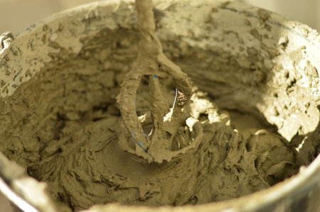 Concrete mixer with pouring cement. Close up on concrete mixer, cement mortar mixing.の写真素材