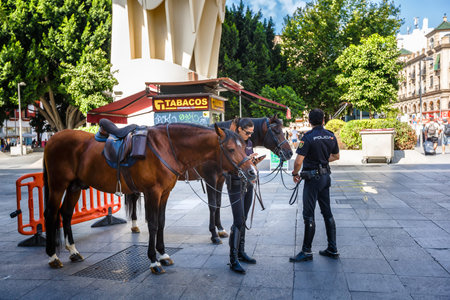 Sevilla, SPAIN - September 10, 2015 : Mounted police on the streets of Seville near Metropol...