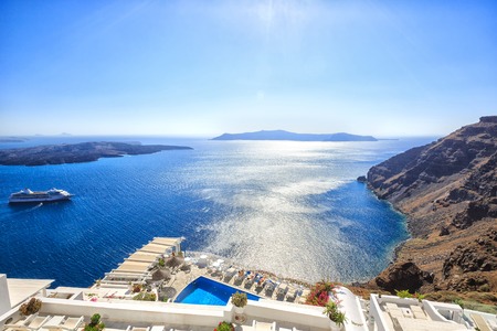 Santorini, Greece - July 04, 2013: Beautiful typical white greek buildings with swimming pool. Sea side of Thira, Santorini islandのeditorial素材