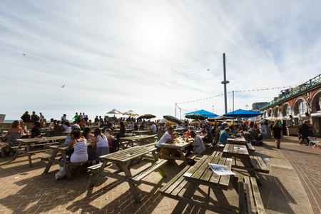 People have rest in Brighton costline restaurants, English channel, tower i360のeditorial素材