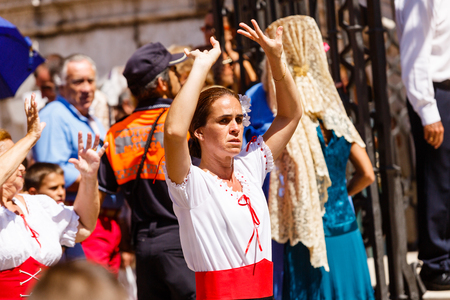 Women dance flamenko ans sing near Malaga Cathedral on city holiday of Holy Virgin Maryのeditorial素材
