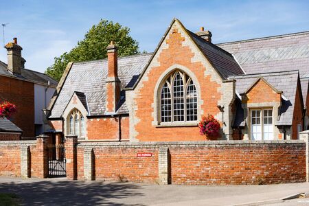 Clare, Suffolk, England - July 24, 2019: cosy view of a small countryside street with a close-up of traditional British little house, bright summer dayの写真素材