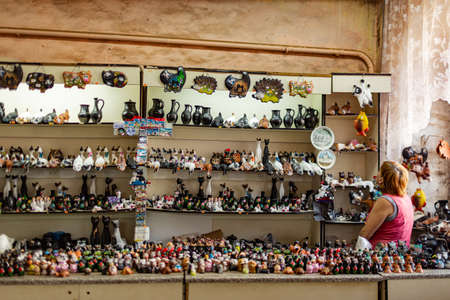 Shoppers at a souvenir shop with local black clay products in the Rostov Kremlinのeditorial素材