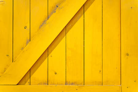 Sunny yellow rustic e wooden texture, wood background banner. cheerful colorの写真素材