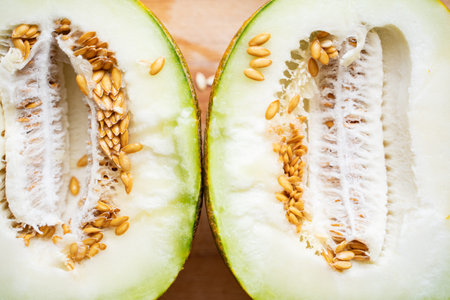 ripe juicy melon cut in half. Brown seeds on the pulp of a delicious fruit.