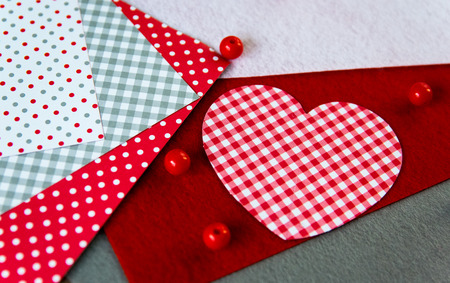 The heart made of paper, handwork, and other materials for creation of a congratulation by Valentines Day.の写真素材