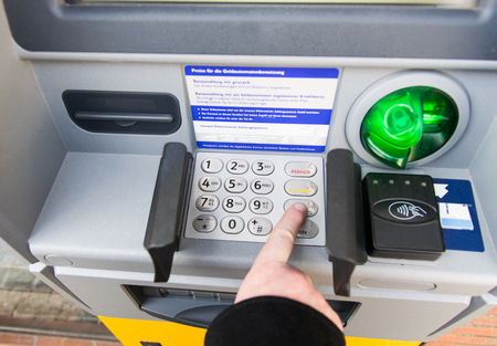 ATM bank machine in spring time. Finance, travel, credit card. Lifestyleの写真素材