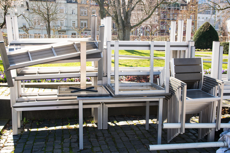 Warehouse on the open air. Chairs and tables outside on the spring sun weather. Furnitureset for summer cafe.の写真素材