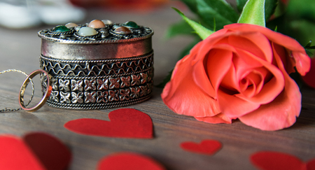 Vintage red gold hearts with chain, pink flower, red paper hearts. Vintage composition for Valentines Day or Womens Day.の写真素材