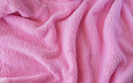 Pink knitted texture fabric. Textile cloth background.の写真素材