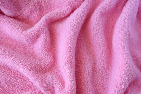 Knitted pink texture fabric. Textile cloth background.の写真素材