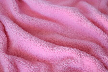 Very soft and gentle pink knitted texture fabric. Textile cloth background.の写真素材