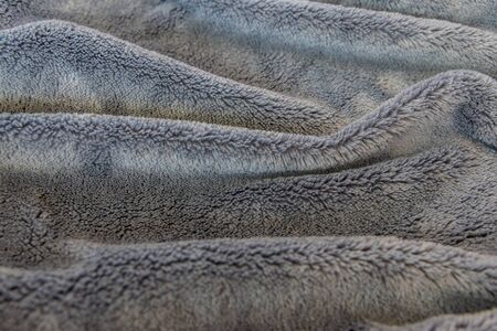 Texture fabric. Textile warm grey knitted cloth background.の写真素材