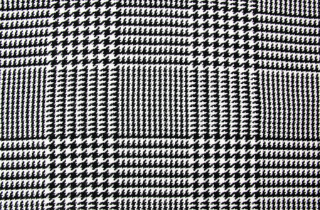 Winter cashmere scarf. Black and white cage texture fabric. Textile warm dark knitted cloth...