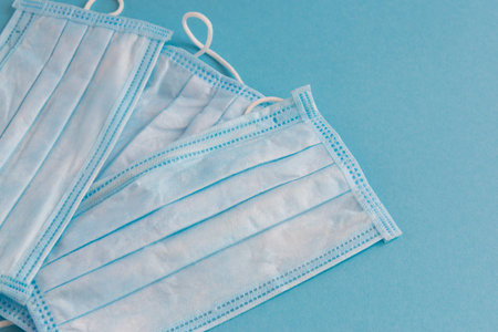 Medical mask for face on the blue background. Antibacterial, against pollution or virus protection....