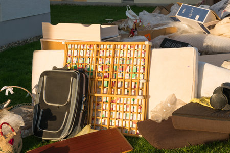 A lot of waste in a city near the haus. Big garbage with old wood furniture, toys, boxes, plastic...