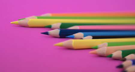 Color pencils on the pink background. Close up. Design concept.の写真素材