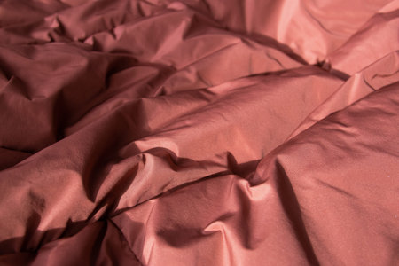 Texture fabric. Textile brown knitted cloth background.