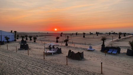 Panoramic beach landscape. Inspire tropical beach seascape horizon. Orange and golden sunset sky and...