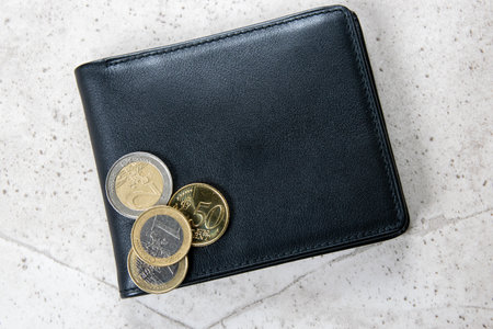 Black wallet with European money. Coins in leather wallet for commerce concept.の写真素材